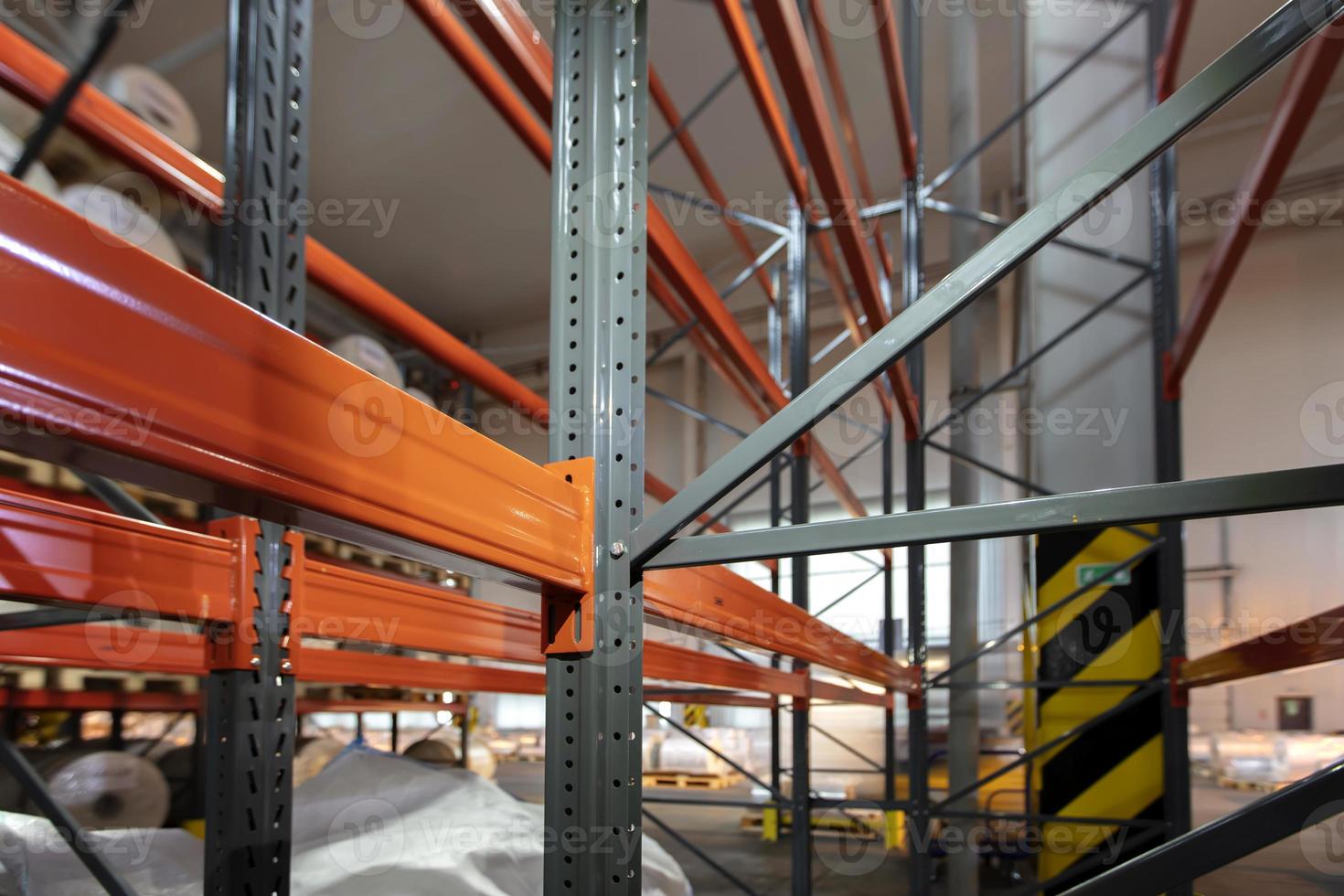 Warehouse premises of a factory or workshop with metal shelves. photo