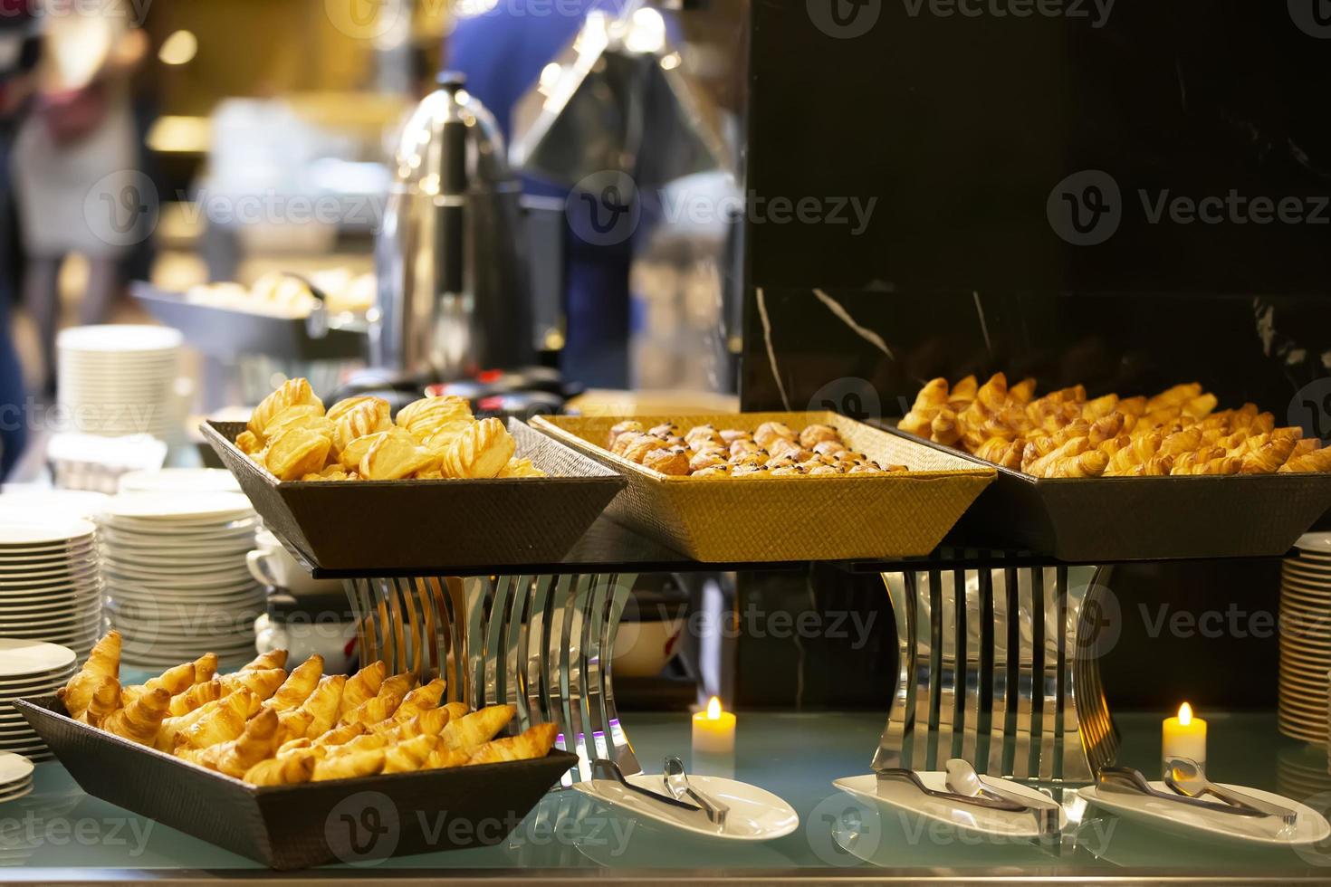 Cookies or small cakes in a bowl at a buffet table. photo