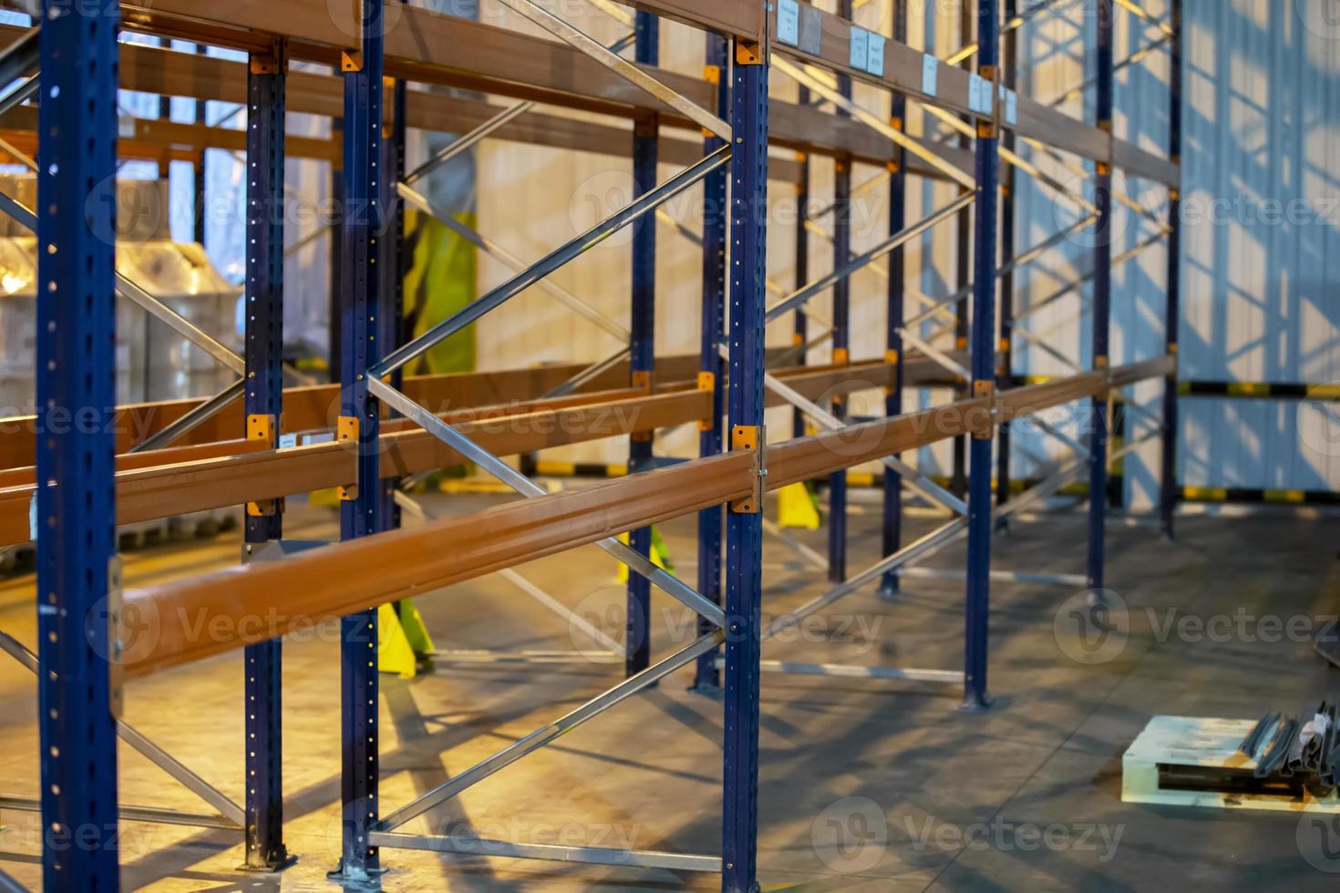 Metal structure of warehouse shelves for storing products. photo