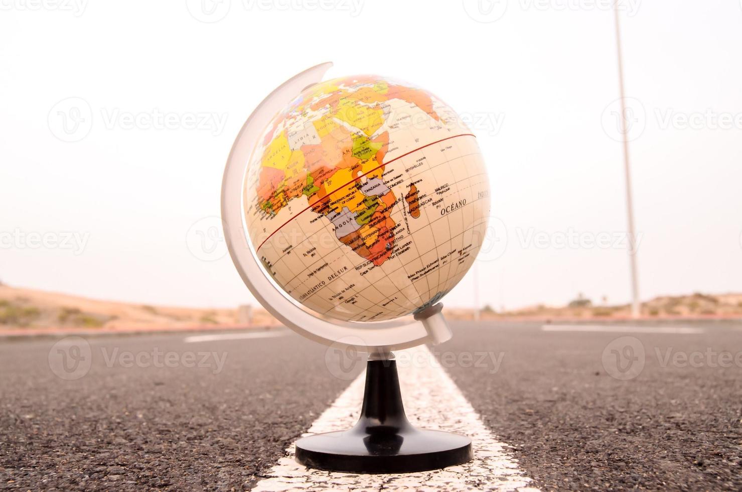 Globe on the road photo