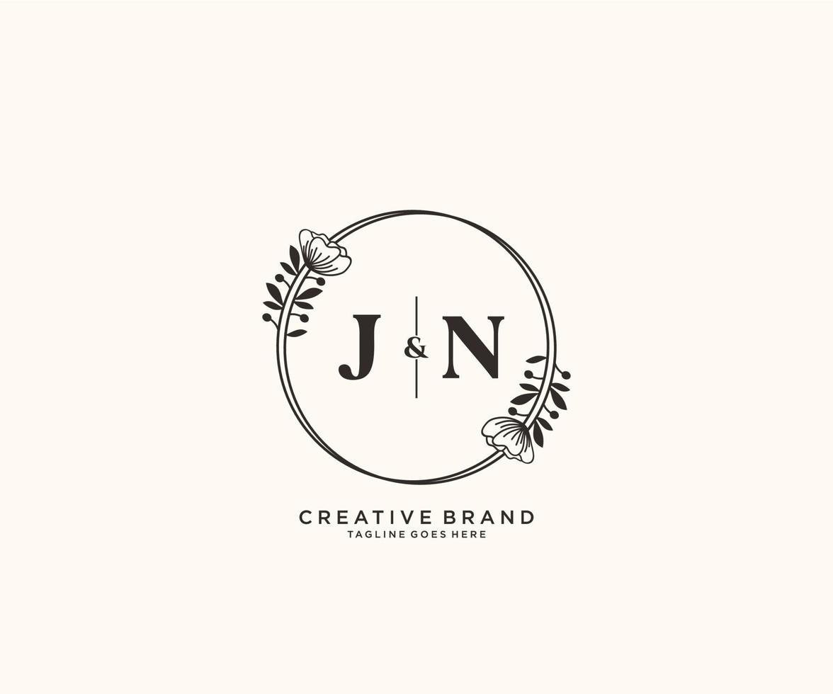 initial JN letters hand drawn feminine and floral botanical logo suitable for spa salon skin hair beauty boutique and cosmetic company. vector