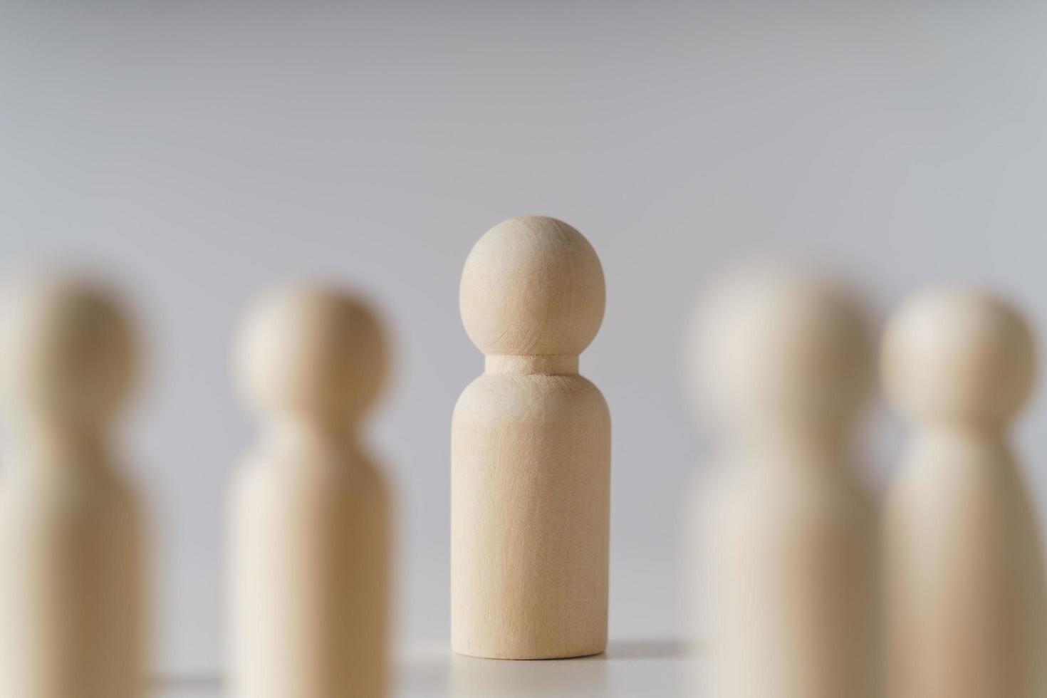 Wooden figures on white background. teamwork, leadership and business team creative thinking and human resources, Recruitment employee concept photo