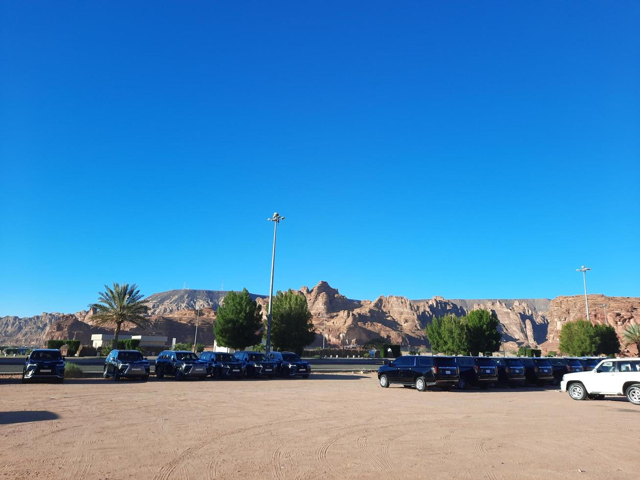 Al Ula, Saudi Arabia, March 2023 - Jeeps are parked at different places in the desert to take tourists to different places during the day in Al Ula, Saudi Arabia. photo