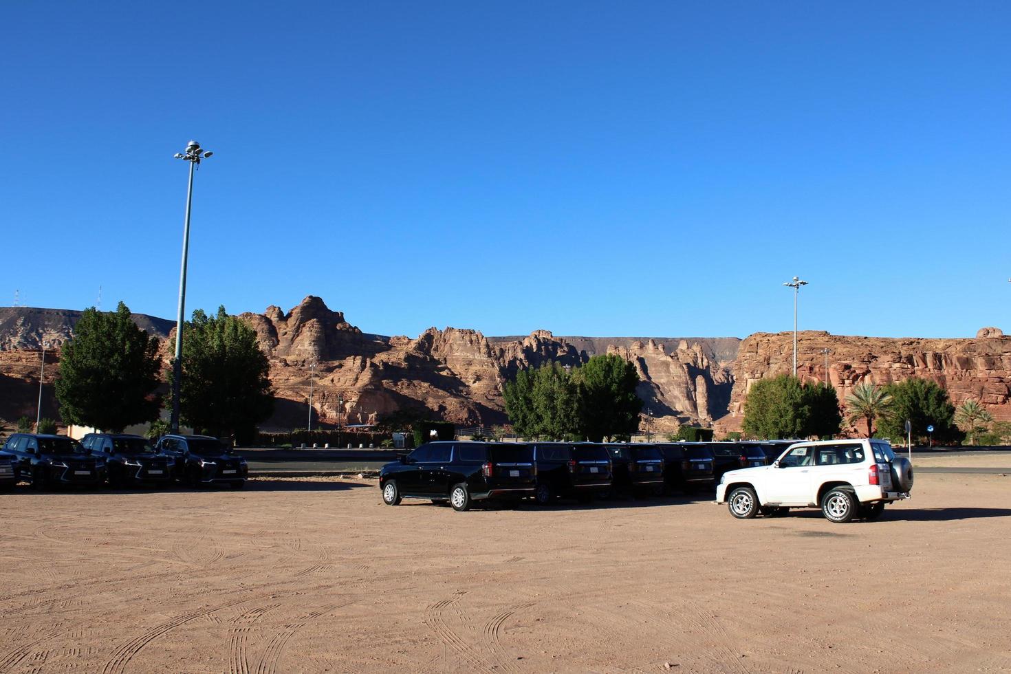 Al Ula, Saudi Arabia, March 2023 - Jeeps are parked at different places in the desert to take tourists to different places during the day in Al Ula, Saudi Arabia. photo