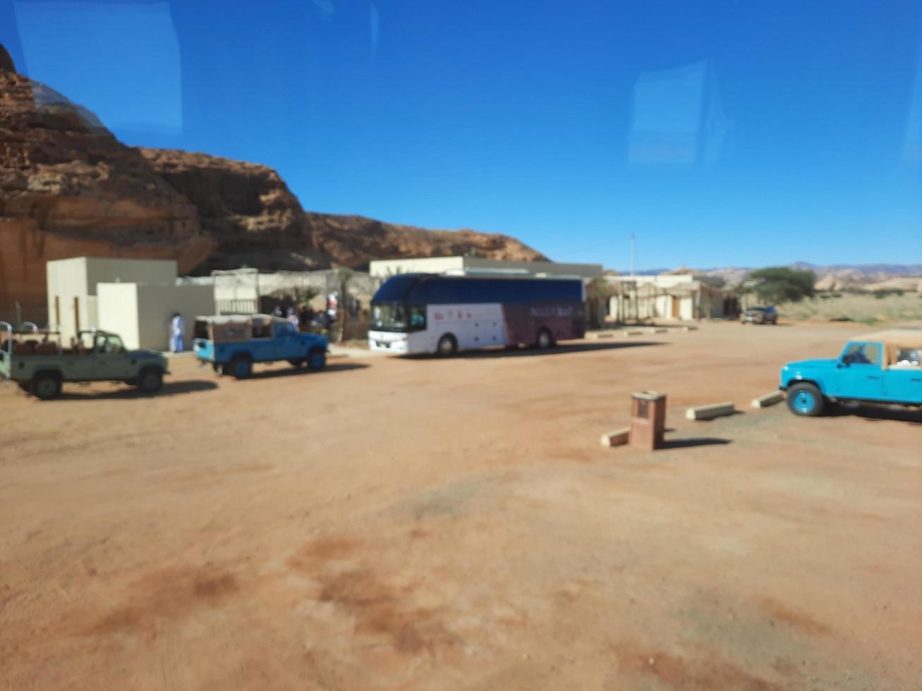 Al Ula, Saudi Arabia, March 2023 - Jeeps are parked at different places in the desert to take tourists to different places during the day in Al Ula, Saudi Arabia. photo