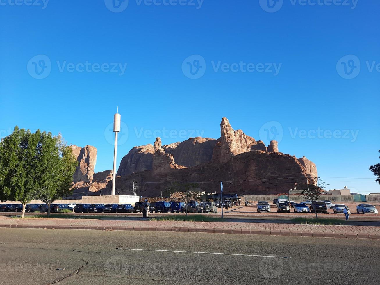 A beautiful daytime view of a winter park in Al Ula, Saudi Arabia. The park is surrounded by ancient hills. photo