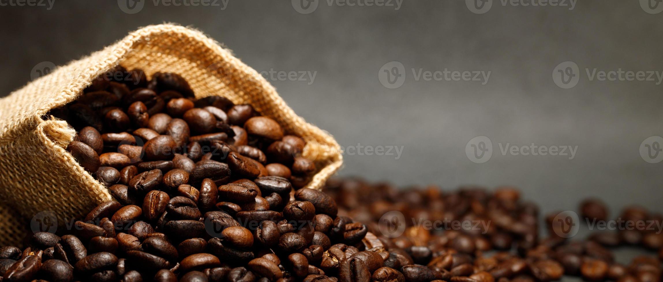 photo macro close up texture of roasted coffee beans dark, can be used as a background.