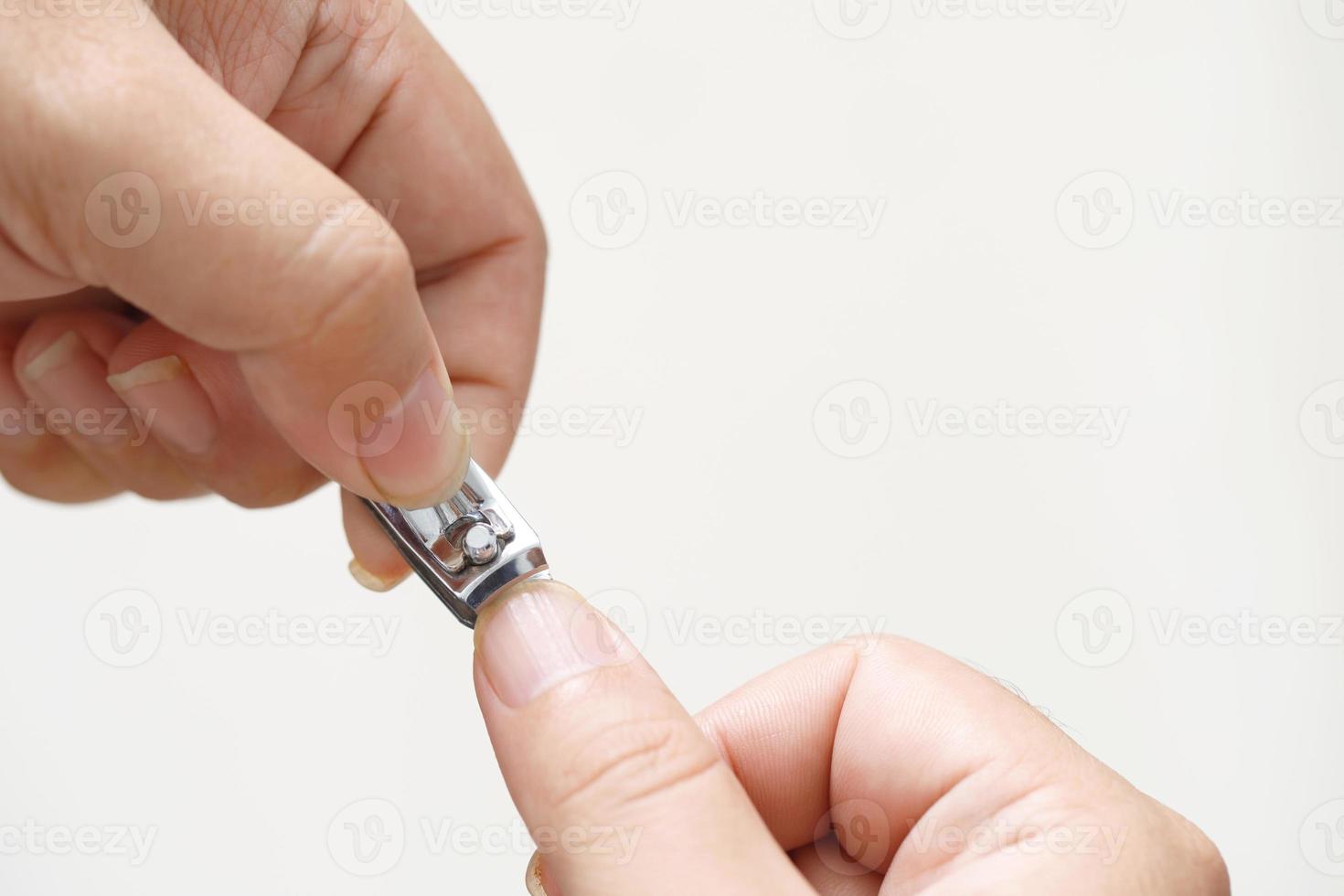 A woman is cleaning dirty nails photo