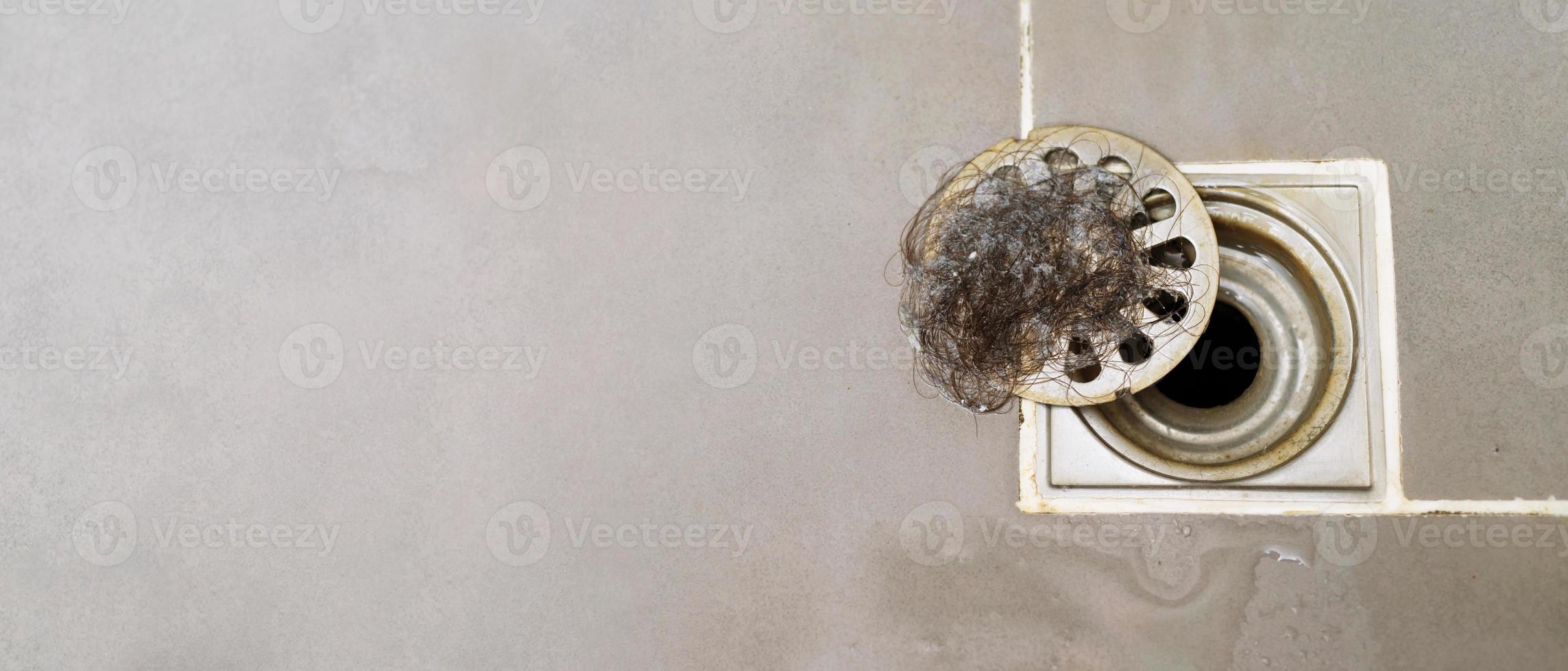 clogged pipe, anti-odor strainer with foul-smelling garbage in the bathroom photo