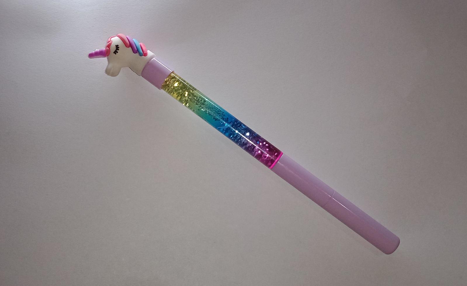 Glitter unicorn pen with white background photo