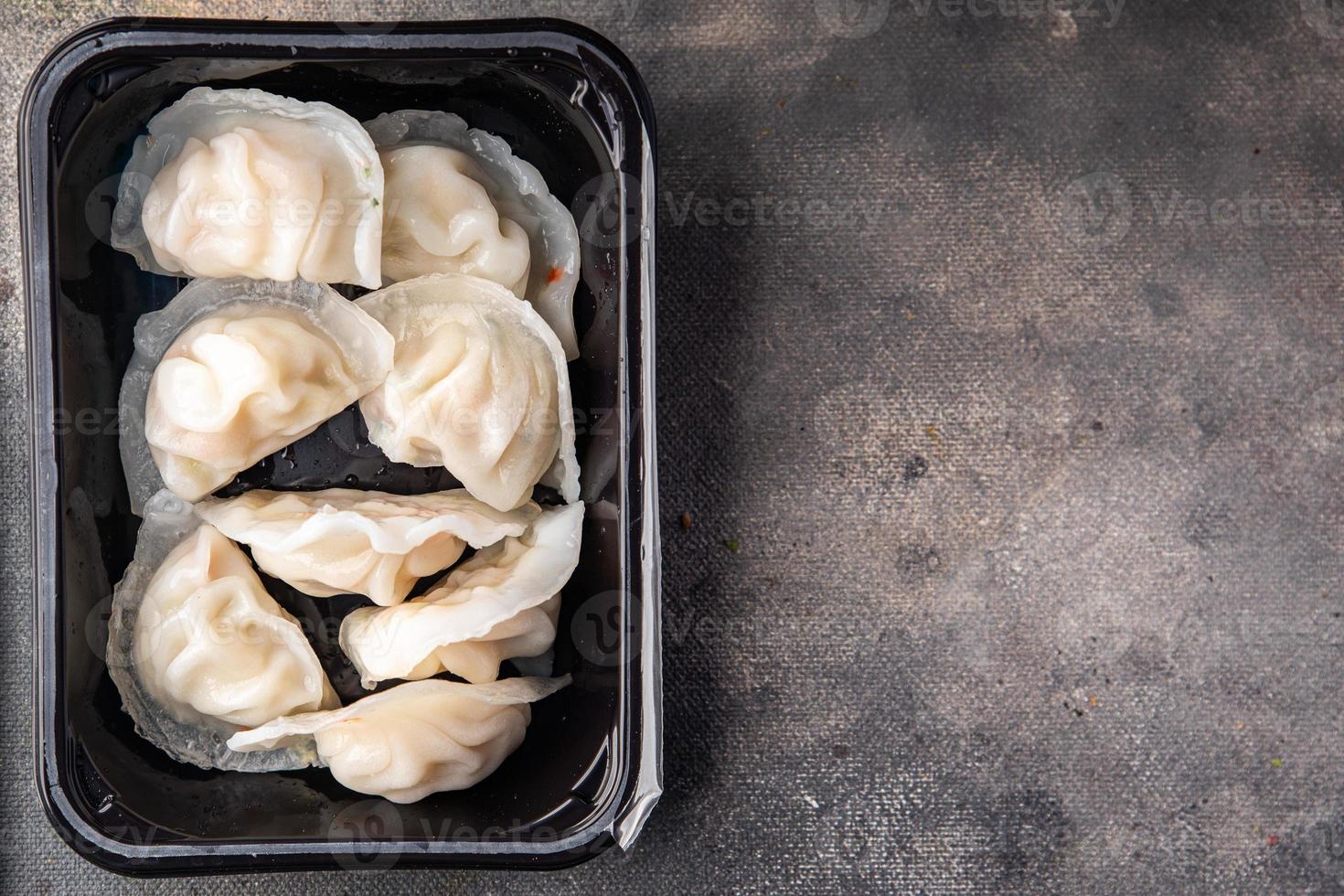 dumplings dim sum rice flour dough Chinese food meal snack on the table copy space food background rustic top view photo