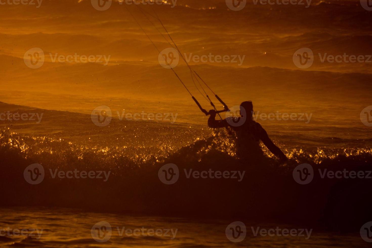Kitesurfer at sunset photo