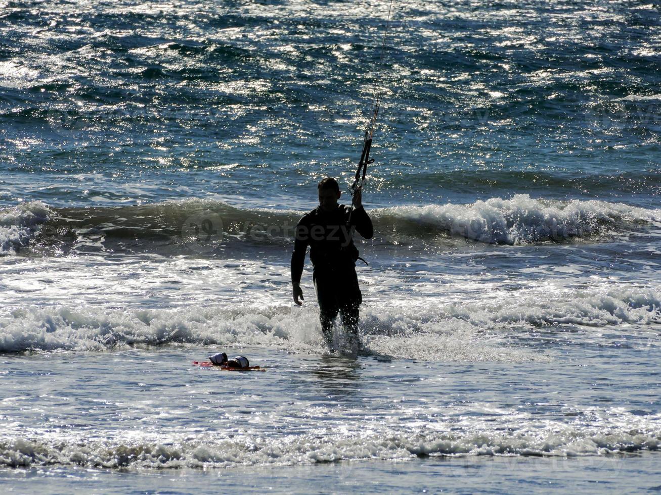 Kitesurfer at sunset photo