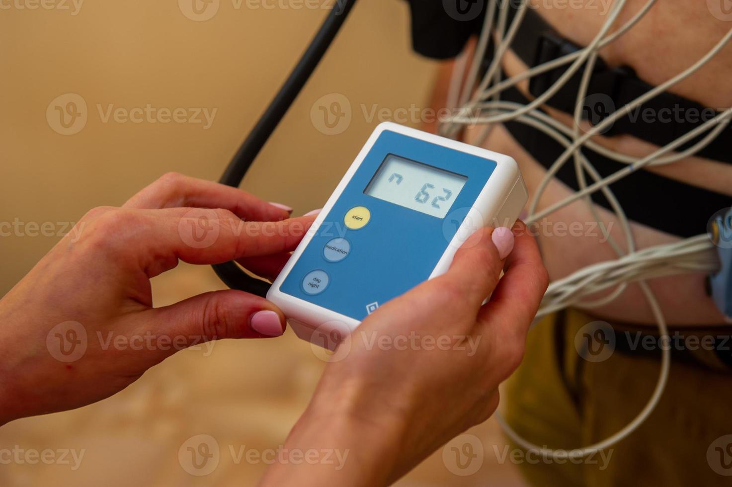 Electrocardiogram, ECG in hand. Clinic of Cardiology heart rate and pulse test closeup. photo