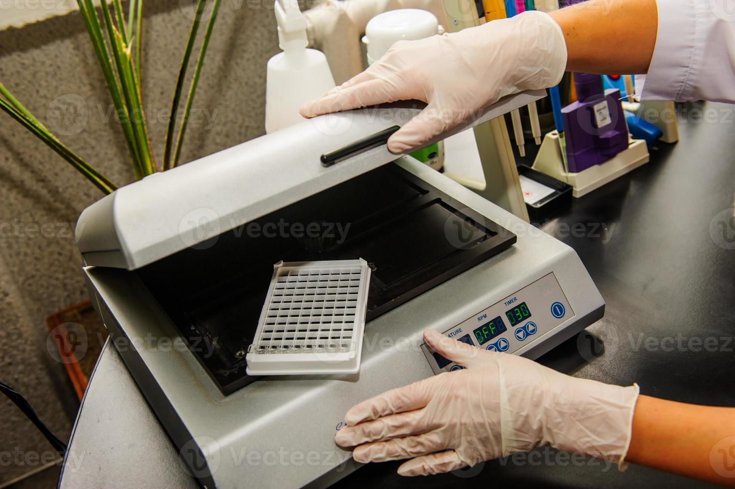 Hands with test tubes close-up. Hands in medical gloves hold tubes. Concept blood test for the presence of a virus. Viral disease test. Human blood in the laboratory. Virusology. photo