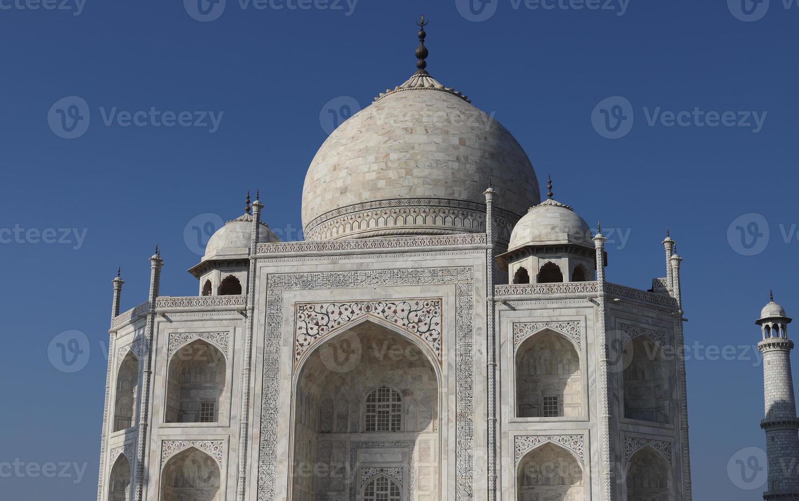 Taj Mahal, Agra, Uttar Pradesh, India, sunny day view, an ivory-white marble mausoleum on the south bank of the Yamuna river in the Indian city of Agra, Uttar Pradesh. photo