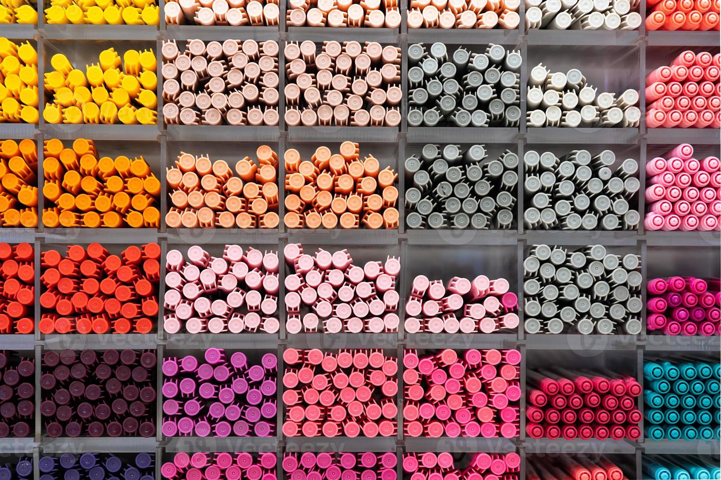 Background of lots assorted colorful pen set. Colored pens on shelves In the shop,Office supplies and stationery. Colorful pens arranged on shelves selling stationery. photo