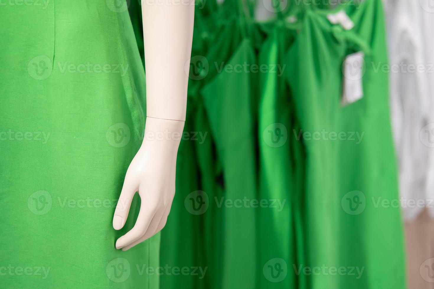 part of mannequin dressed in casual clothes. shelf display in shop mall store. Store Of Shopping Center. photo