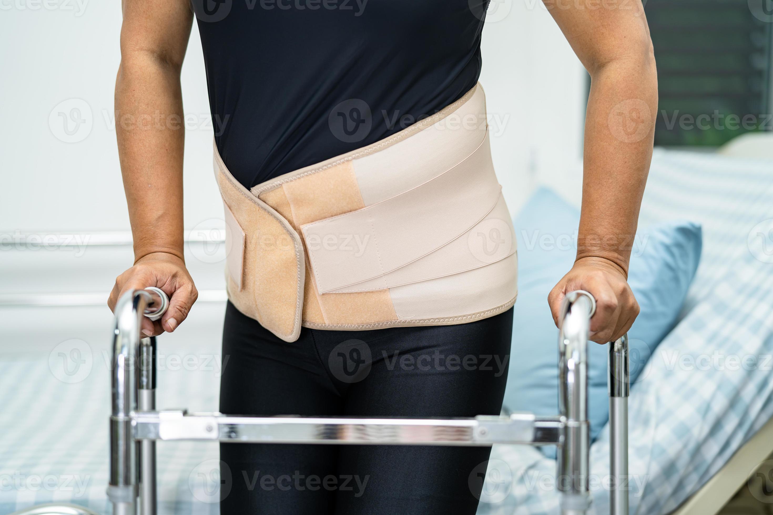 Premium Photo  Asian lady patient wearing back pain support belt for  orthopedic lumbar.