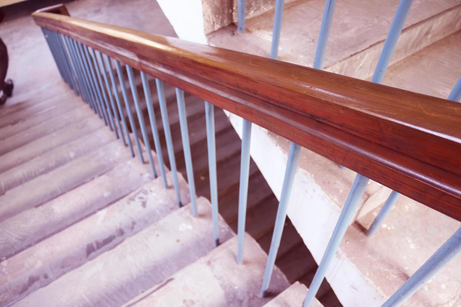 Rangpur,Bangladesh. February 18, 2020. Staircase with wood railing.Stairs in a modern College University building.Luxury custom built home interior. white walls and a staircase.Spiral staircase photo