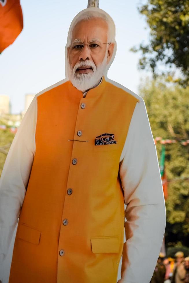 New Delhi, India - January 16 2023 - Prime Minister Narendra Modi cut out during BJP road show, the statue of PM Modi while attending a big election rally in the capital photo