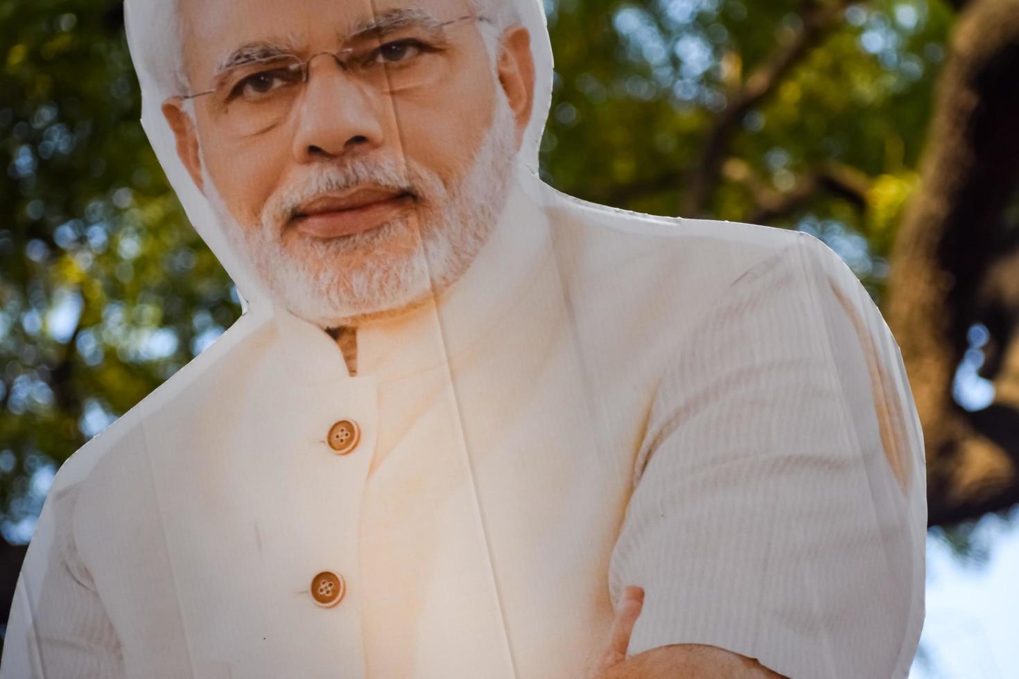 New Delhi, India - January 16 2023 - Prime Minister Narendra Modi cut out during BJP road show, the statue of PM Modi while attending a big election rally in the capital photo