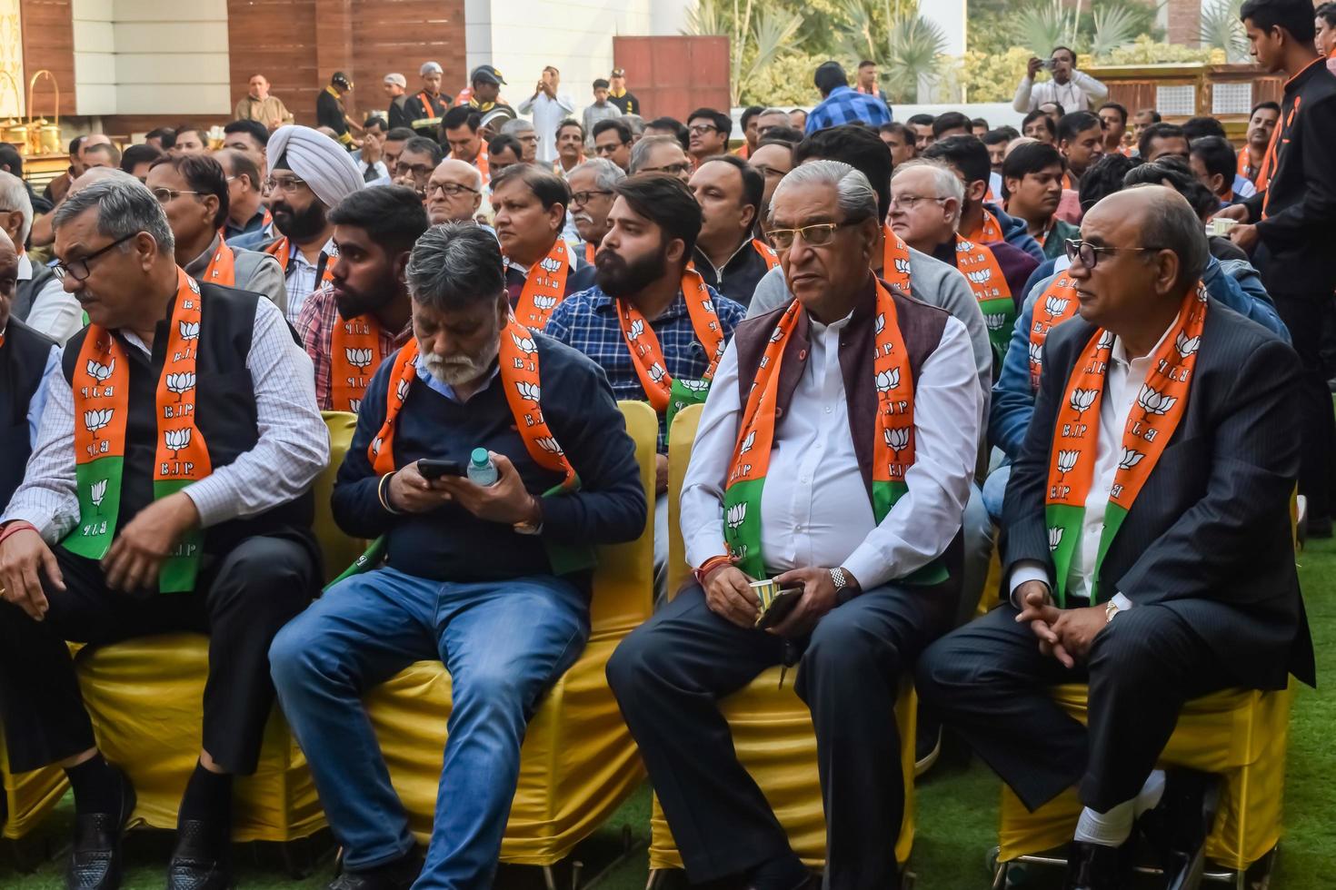 Delhi, India, December 02 2022 -Bharatiya Janata Party - BJP supporter during mega road show in support of BJP candidate Pankaj Luthara to file nomination papers ahead of MCD local body Elections 2022 photo