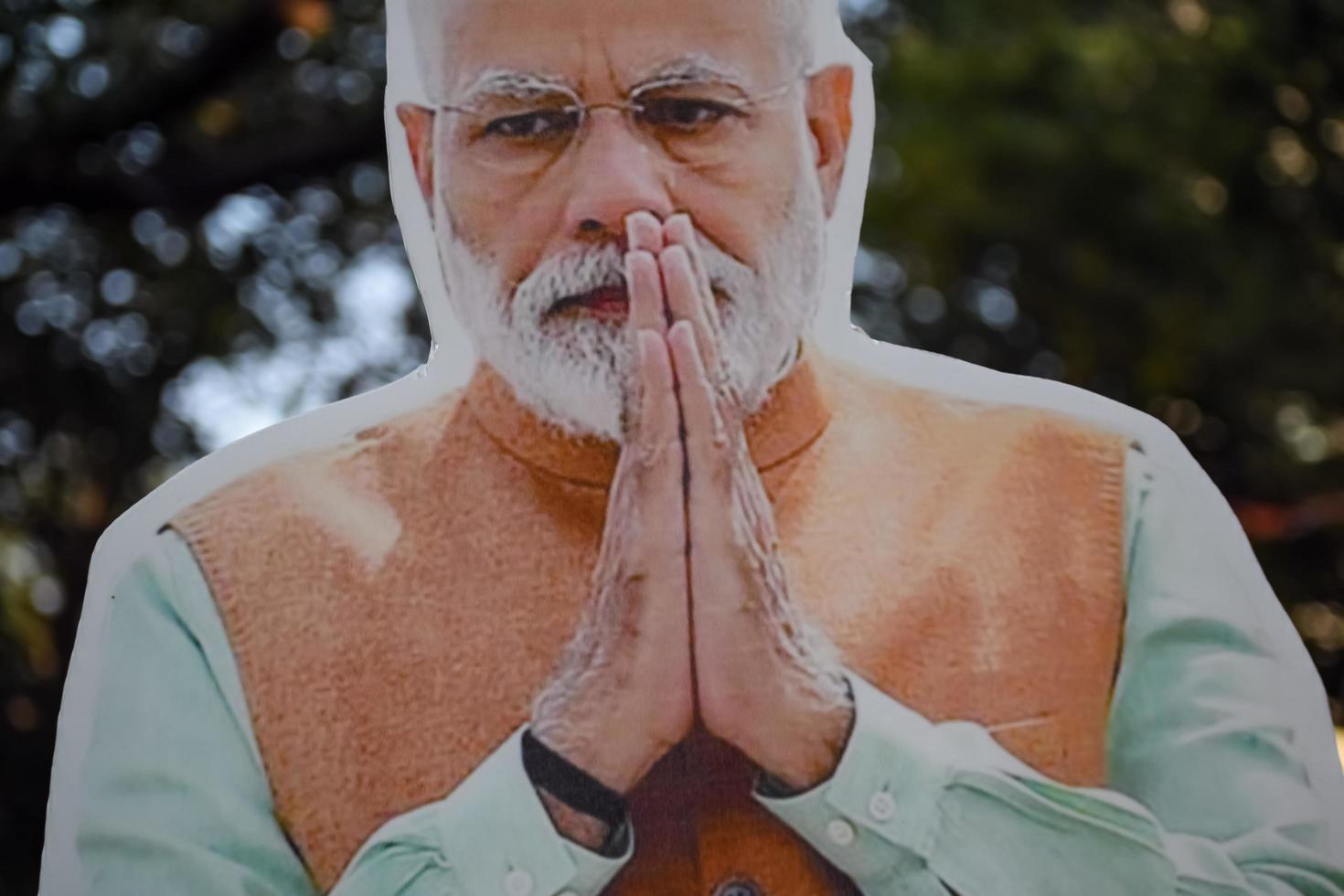 New Delhi, India - January 16 2023 - Prime Minister Narendra Modi cut out during BJP road show, the statue of PM Modi while attending a big election rally in the capital photo