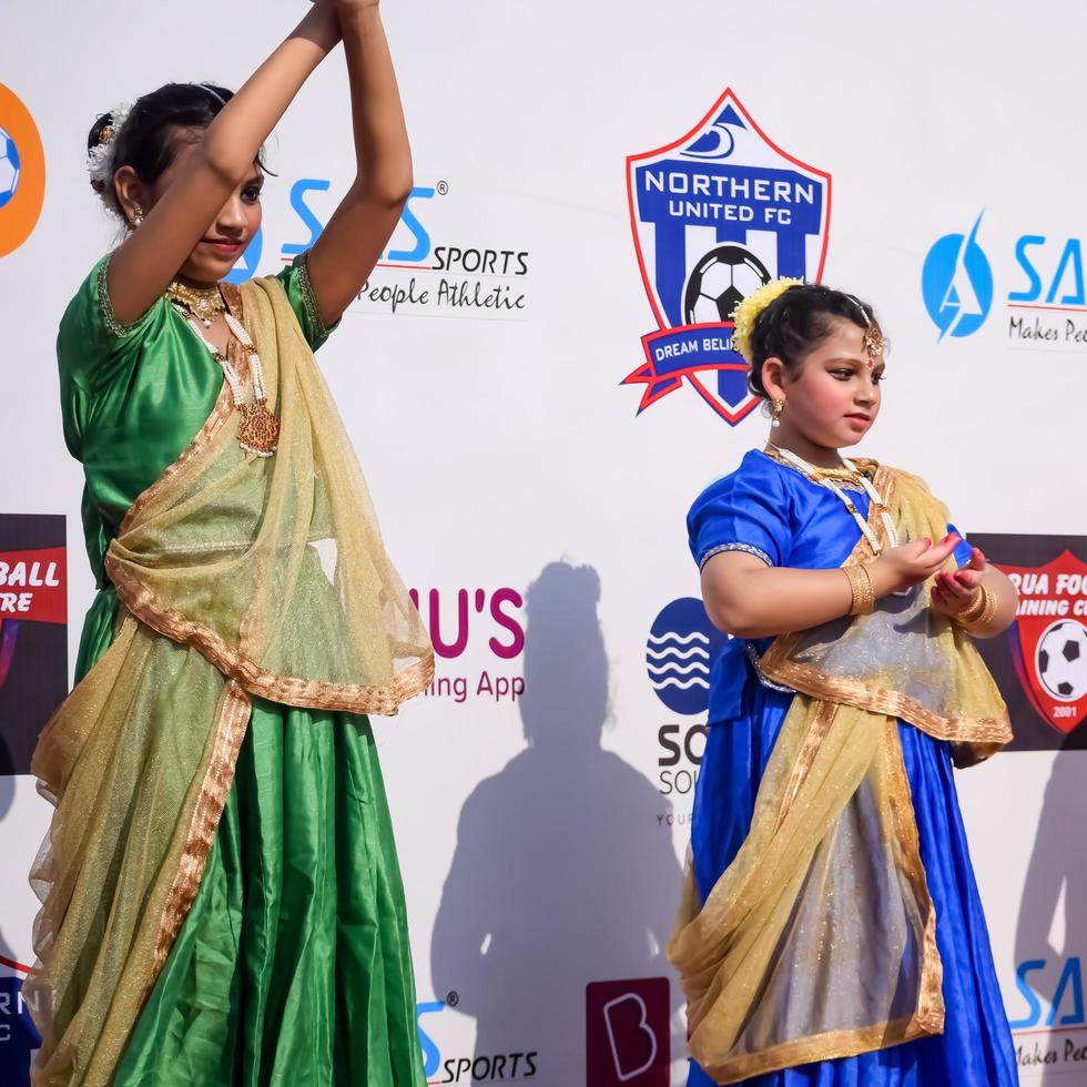 Delhi, India - December 11 2022 - Bharathanatyam Indian classical odissi dancers performing at stage. Beautiful Indian girl dancers in the posture of Indian dance. Indian classical dance Bharatanatyam photo