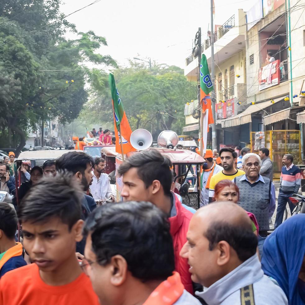 Delhi, India, December 02 2022 -Bharatiya Janata Party - BJP supporter during mega road show in support of BJP candidate Pankaj Luthara to file nomination papers ahead of MCD local body Elections 2022 photo