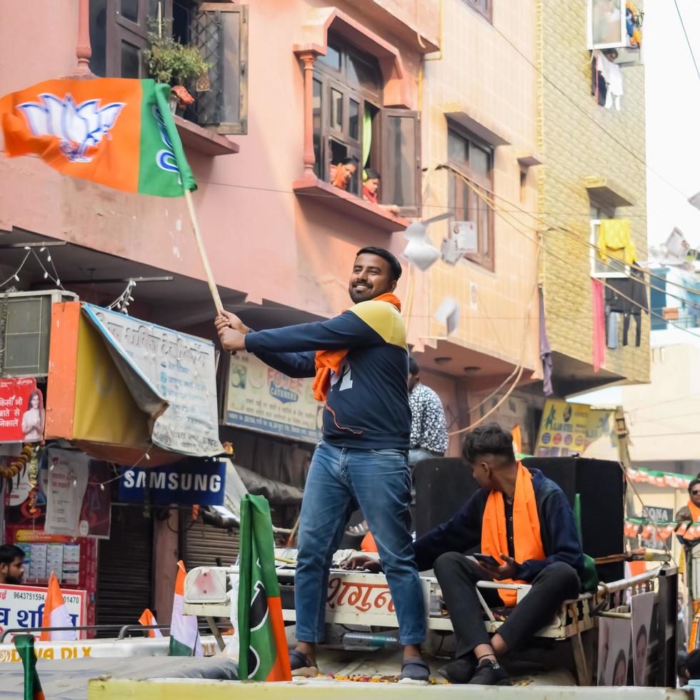 Delhi, India, December 02 2022 -Bharatiya Janata Party - BJP supporter during mega road show in support of BJP candidate Pankaj Luthara to file nomination papers ahead of MCD local body Elections 2022 photo