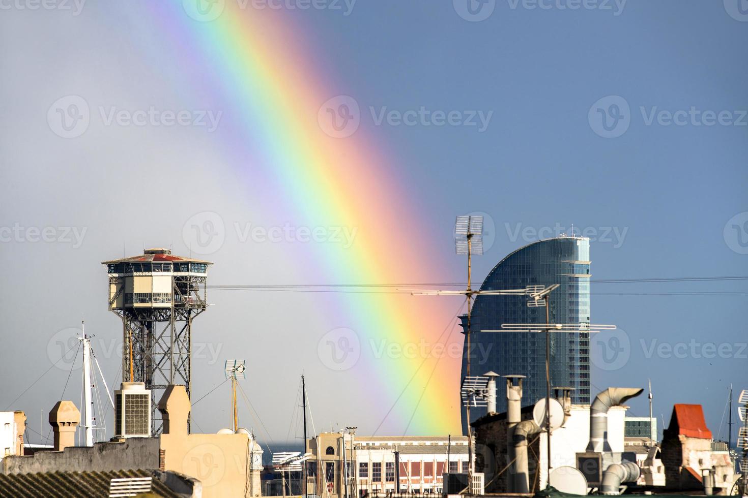 rainbow over barcelona city photo
