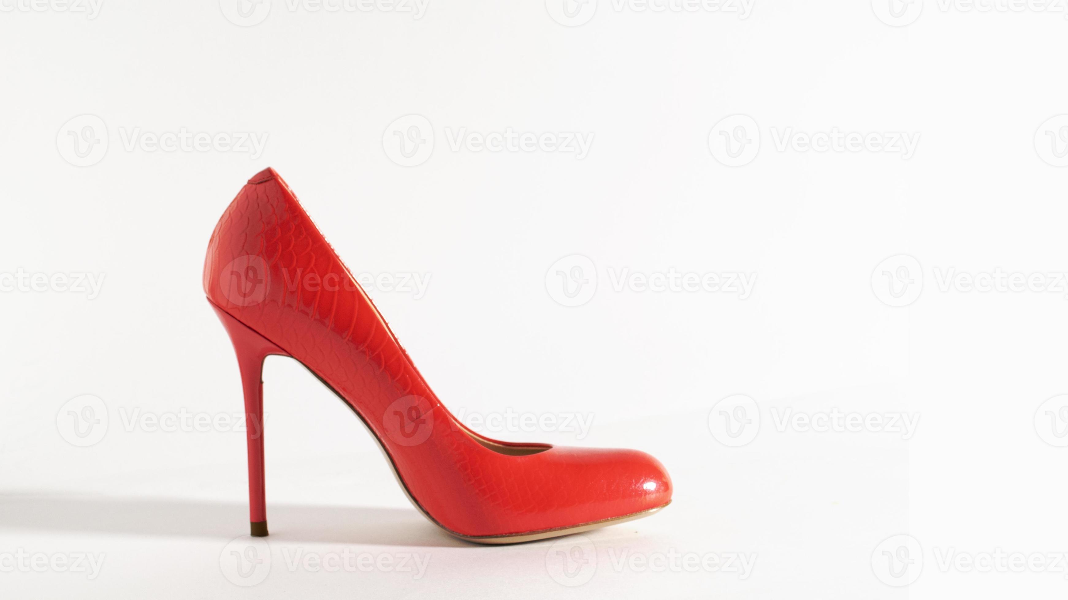 Bright red shoes on the white background. Side view picture. Beautiful