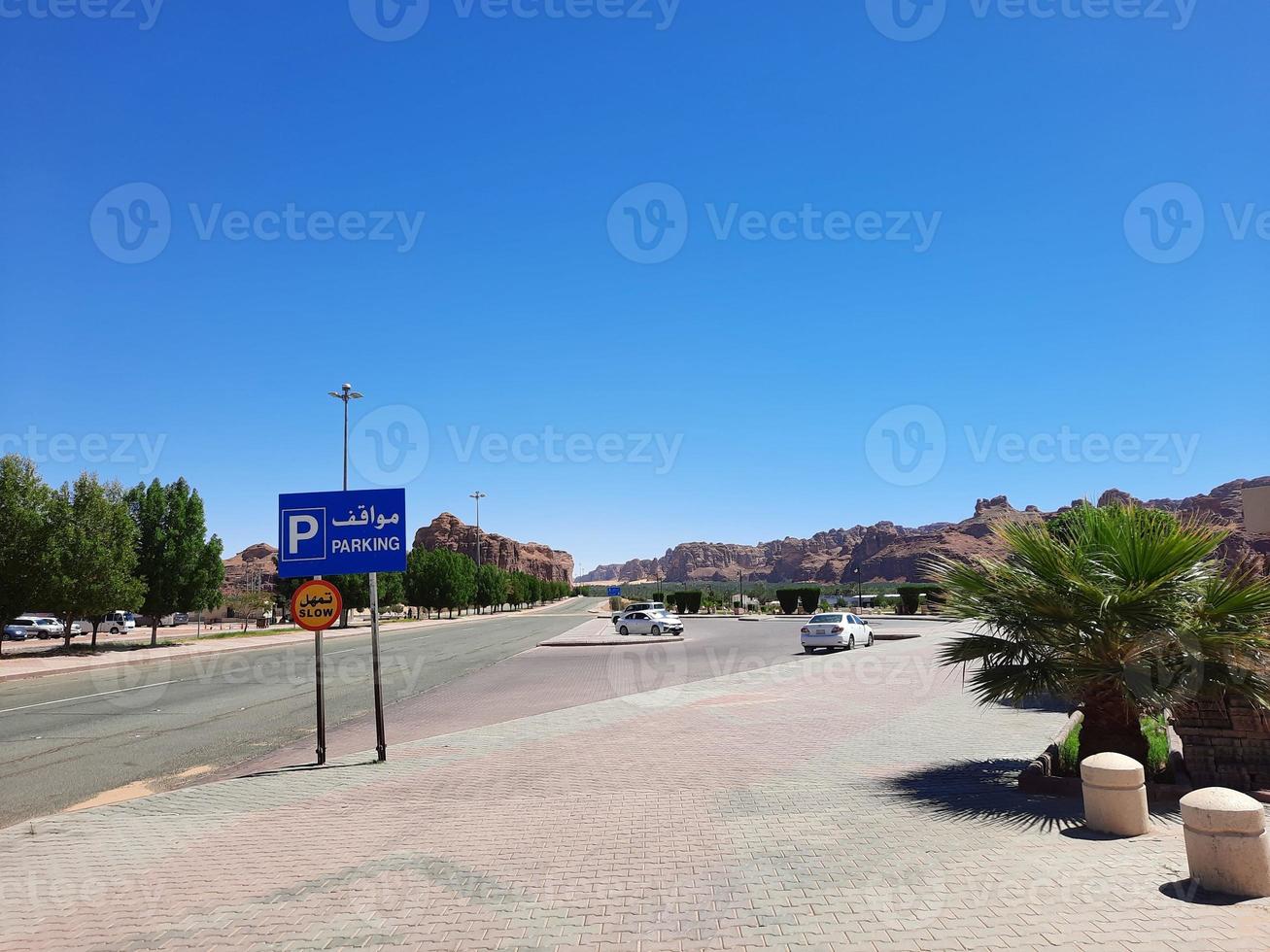 A beautiful daytime view of a winter park in Al Ula, Saudi Arabia. The park is surrounded by ancient hills. photo