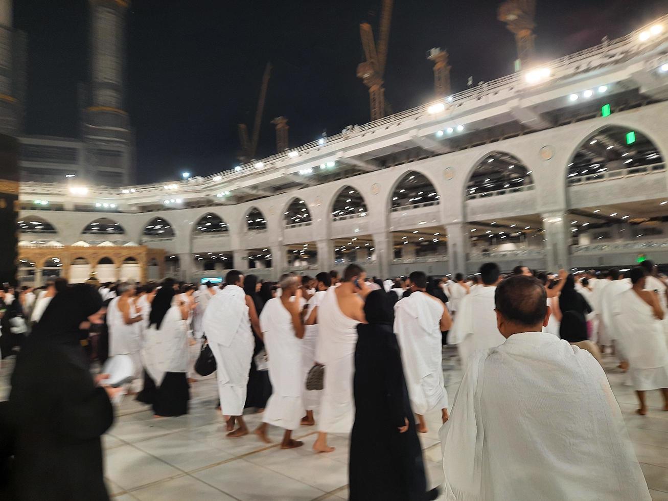 Mecca, Saudi Arabia, March 2023 - During the month of Ramadan, pilgrims from all over the world perform Tawaf around the Kabah at the Masjid al-Haram in Mecca.. photo