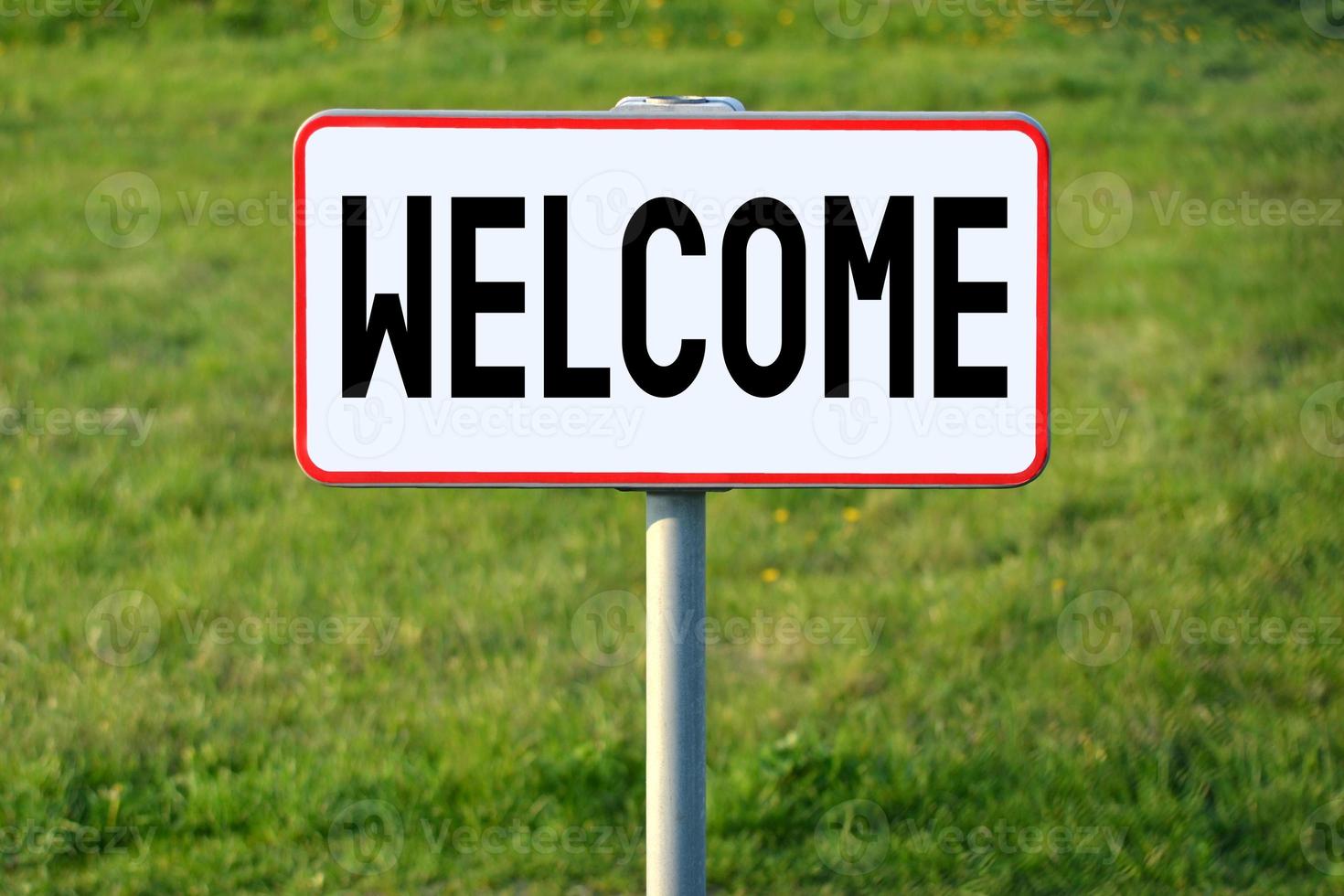 Welcome - White Sign on a Grass photo