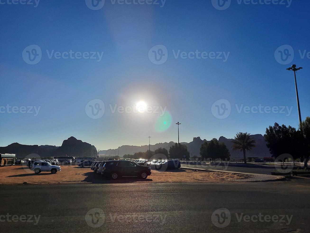 A beautiful daytime view of a winter park in Al Ula, Saudi Arabia. The park is surrounded by ancient hills. photo