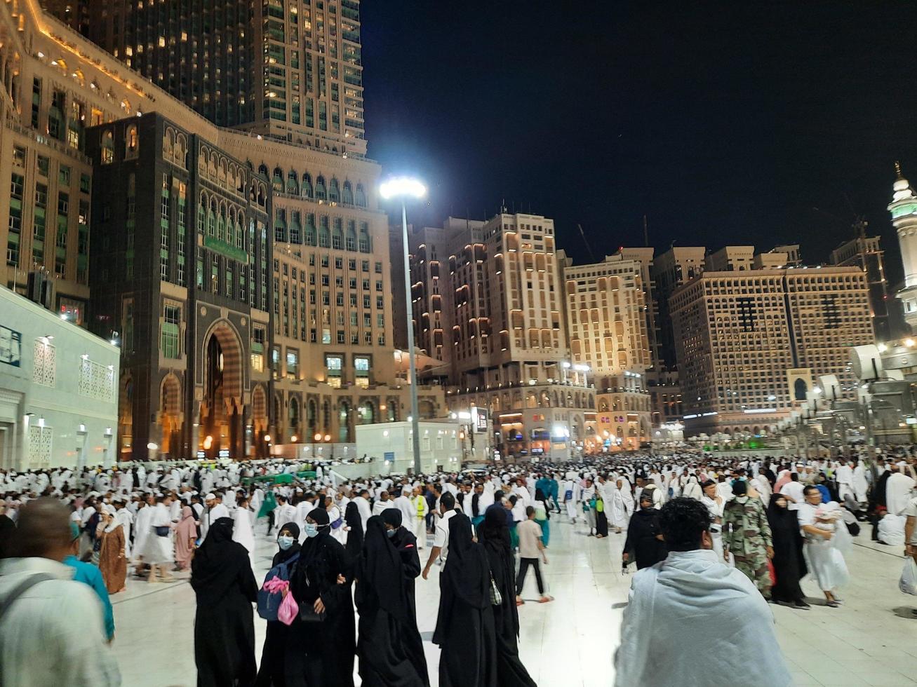 Mecca, Saudi Arabia, March 2023 - A large number of Umrah pilgrims in front of the Clock Tower in Masjid Al Haram. photo