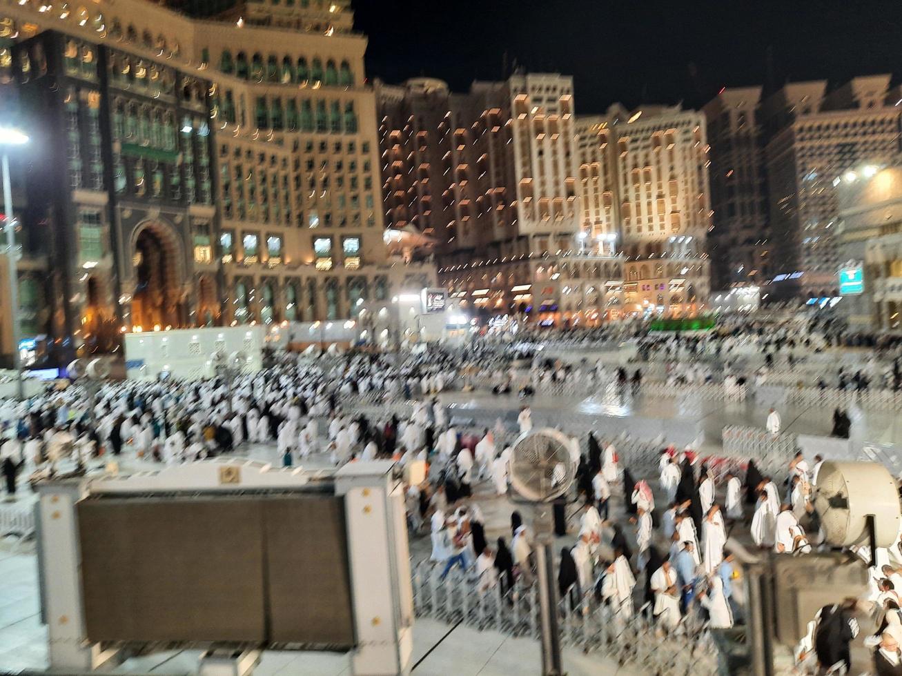 Mecca, Saudi Arabia, March 2023 - A large number of Umrah pilgrims in front of the Clock Tower in Masjid Al Haram. photo