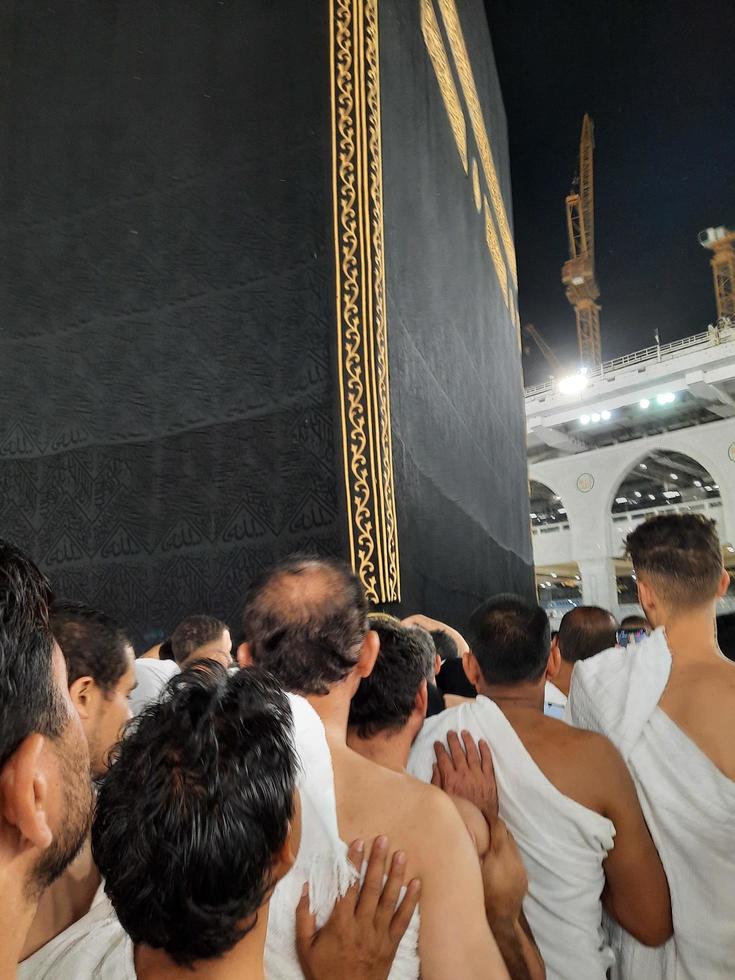 Mecca, Saudi Arabia, March 2023 - During the month of Ramadan, pilgrims from all over the world perform Tawaf around the Kabah at the Masjid al-Haram in Mecca.. photo