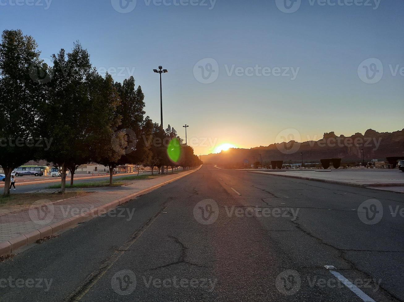 A beautiful daytime view of a winter park in Al Ula, Saudi Arabia. The park is surrounded by ancient hills. photo