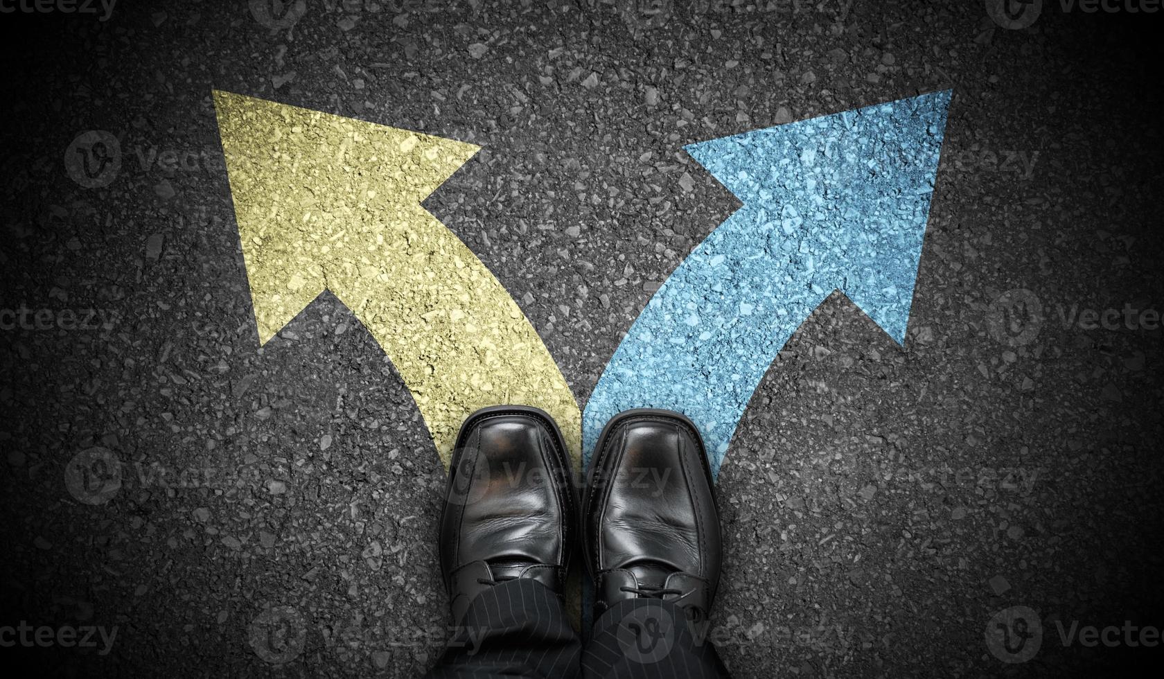 Black Business Shoes and Two Colorful Chalky Arrows on Asphalt - Choice Concept photo