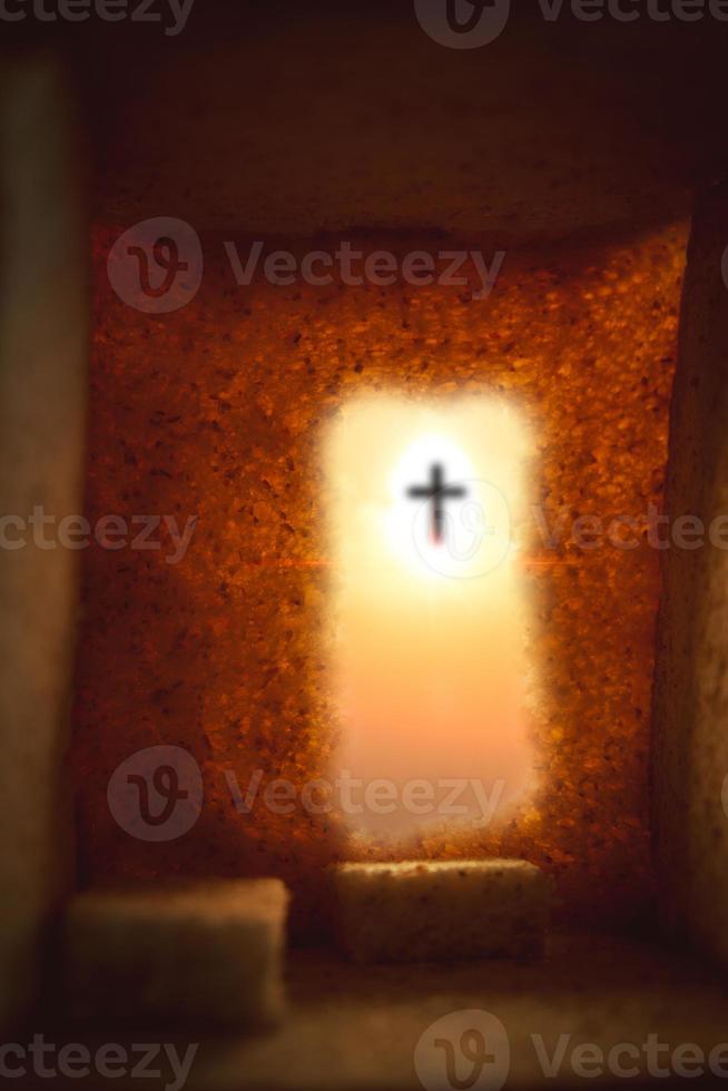 cave or tunnel It is the tomb where his lifeless body is placed. The concept of the resurrection of Jesus in Christianity. Crucifixion on Calvary or Golgotha hills in holy bible. photo