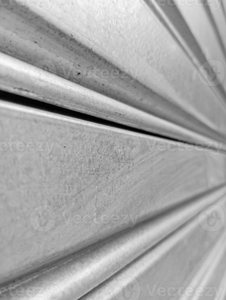 The background is silver with stripes because this is a car garage door that was photographed from several perspectives photo