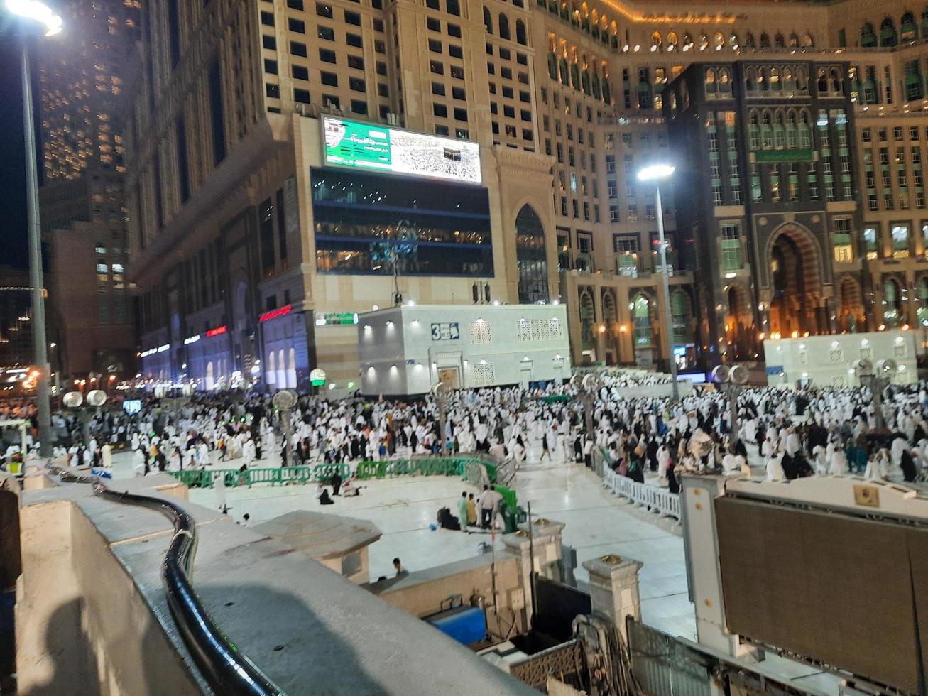 Mecca, Saudi Arabia, March 2023 - A large number of Umrah pilgrims in front of the Clock Tower in Masjid Al Haram. photo