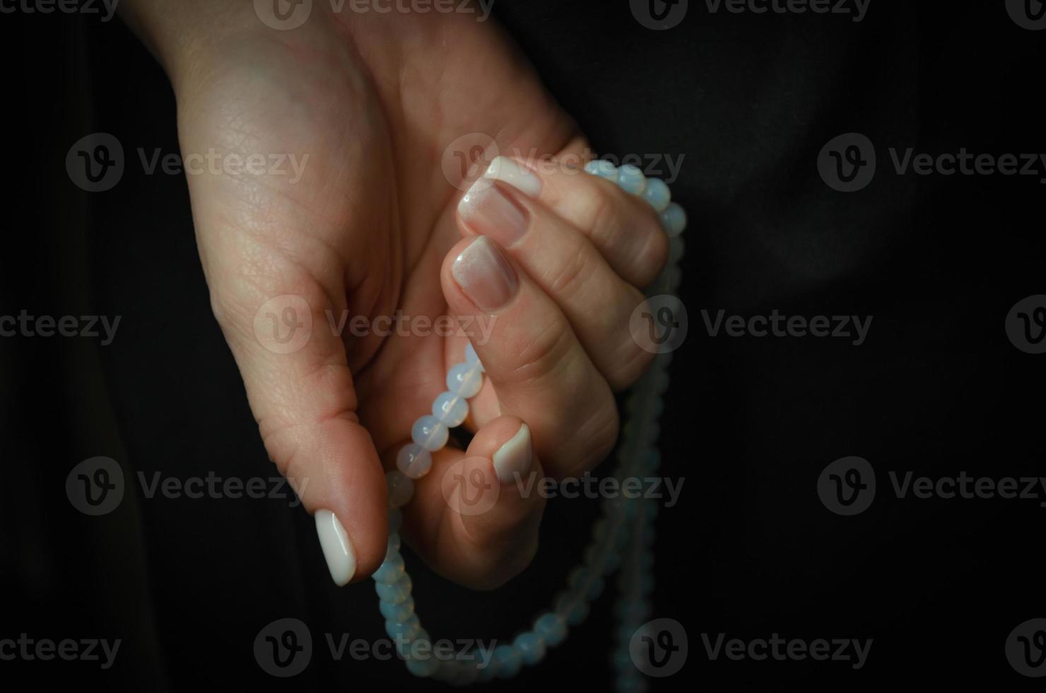 on a dark background light nails after manicure photo