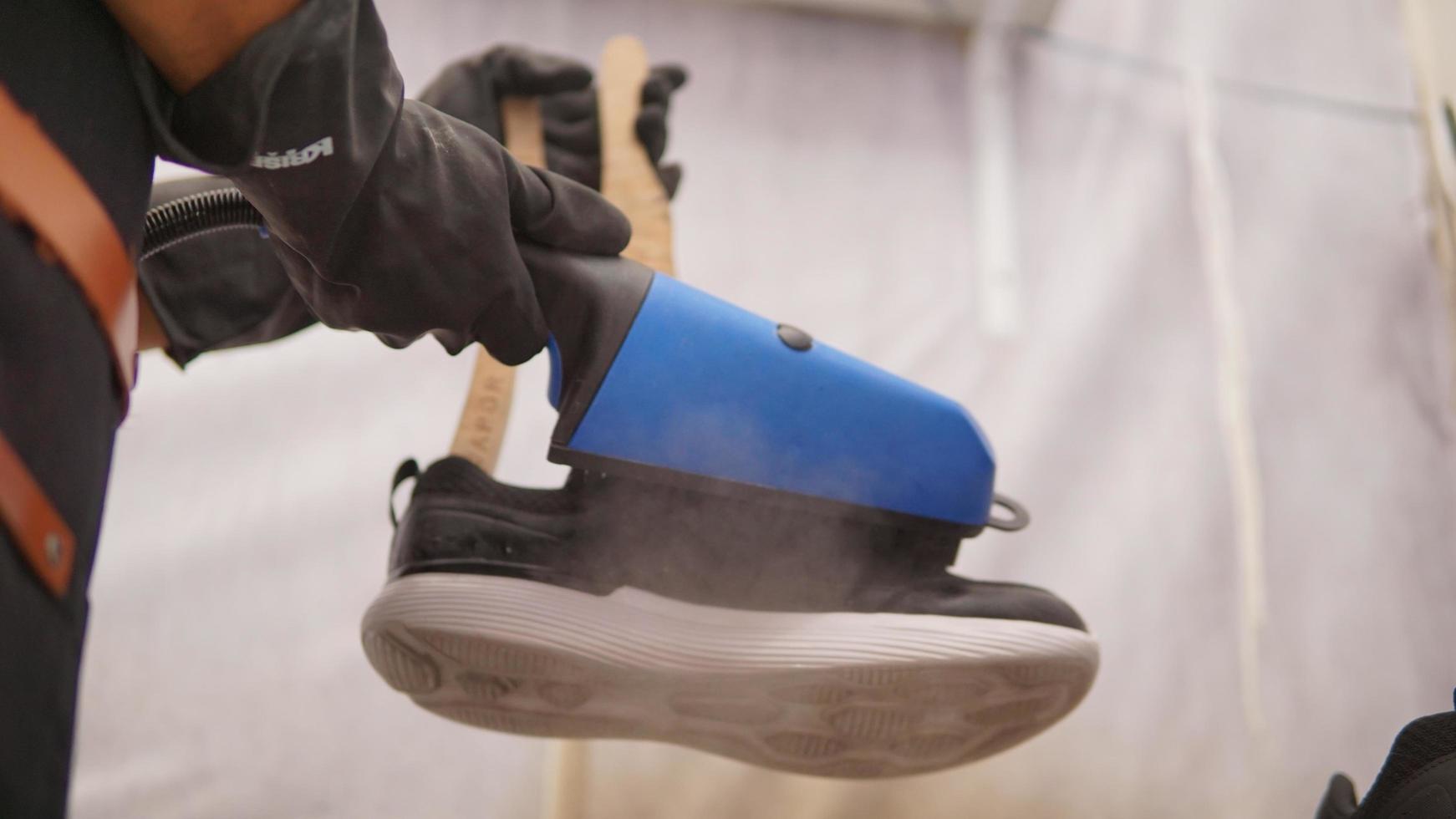 a shoe being washed using a scarpavapor steam cleaner photo