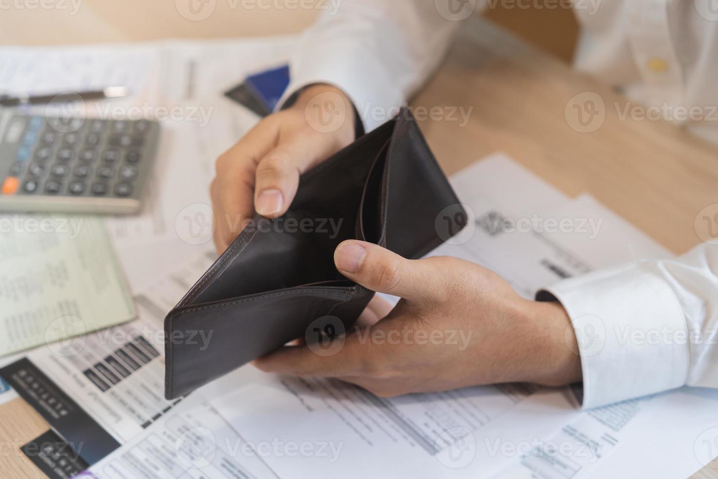 Stressed, Problem people asian man, male holding and open an empty wallet not have money, credit card, not to payment bill, loan or expense in pay. Bankruptcy, bankrupt and debt financial concept. photo