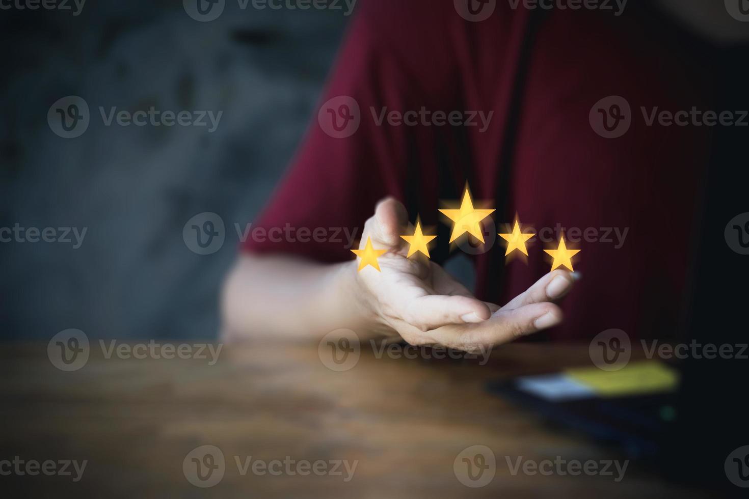 Businesswoman hand showing five star rating, Customer review and evaluation concept. with copy space. giving a five star rating. Service rating, satisfaction concept. photo