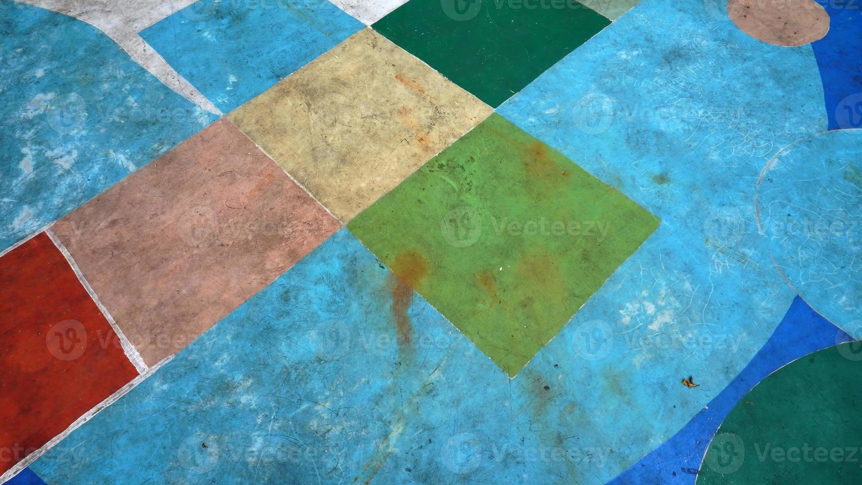 Abstract art of painting on the floor in an elementary school field photo